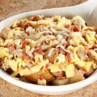 Meat Lover's Skillet · Two scrambled eggs, ham, crumbled sausage, bacon on a bed of seasoned home fries topped with...