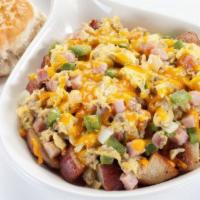 Farmer's Skillet · Two scrambled eggs, ham, crumbled sausage, onions, bell peppers, on a bed of seasoned home f...
