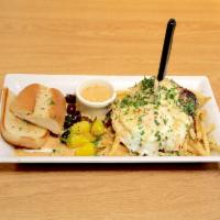 Portuguese Steak and Eggs · Skirt steak marinated in a Portuguese garlic sauce, 2 basted eggs, fries and French roll.