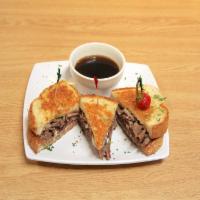 Beefeater Sandwich · Thin slices of roast beef and Swiss cheese on grilled sourdough cheese bread. Served  with h...