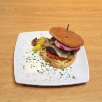 Mushroom Swiss Burger · A thick, juicy fresh patty topped with Swiss cheese and smothered with fresh sliced mushrooms.