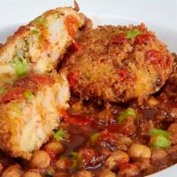Aloo Tikki Chaat · Deep fried mashed potatoes and peas with herbs and spices.