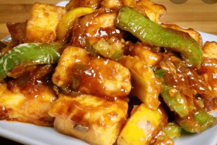 Chilli Paneer · Cottage cheese with bell pepper onions and spices 