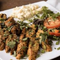 Lamb Seekh Kabab · Ground, lamb marinated om spices on skewers and cooked in clay oven.