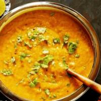 Dal Tadka · Traditional yellow lentil cooked with fresh tomatoes and garlic.