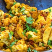 Aloo Gobi · Popular Indian dish Fresh cauliflower and potato cooked with onions, tomatoes ,ginger Garlic...