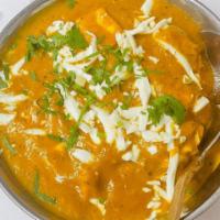 Shahi Paneer · Homemade cheese cooked with onions and bell peppers in creamy sauce. Vegetarian.