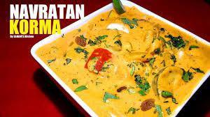 Navratan Korma · Vegetables cooked with green peas , onions and tomatoes.
