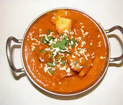 Shrimp Vindaloo · Shrimp cooked with spicy sauce and potatoes.
