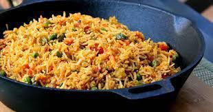 Pulao Rice · Basmati rice cooked with cumin and green peas.