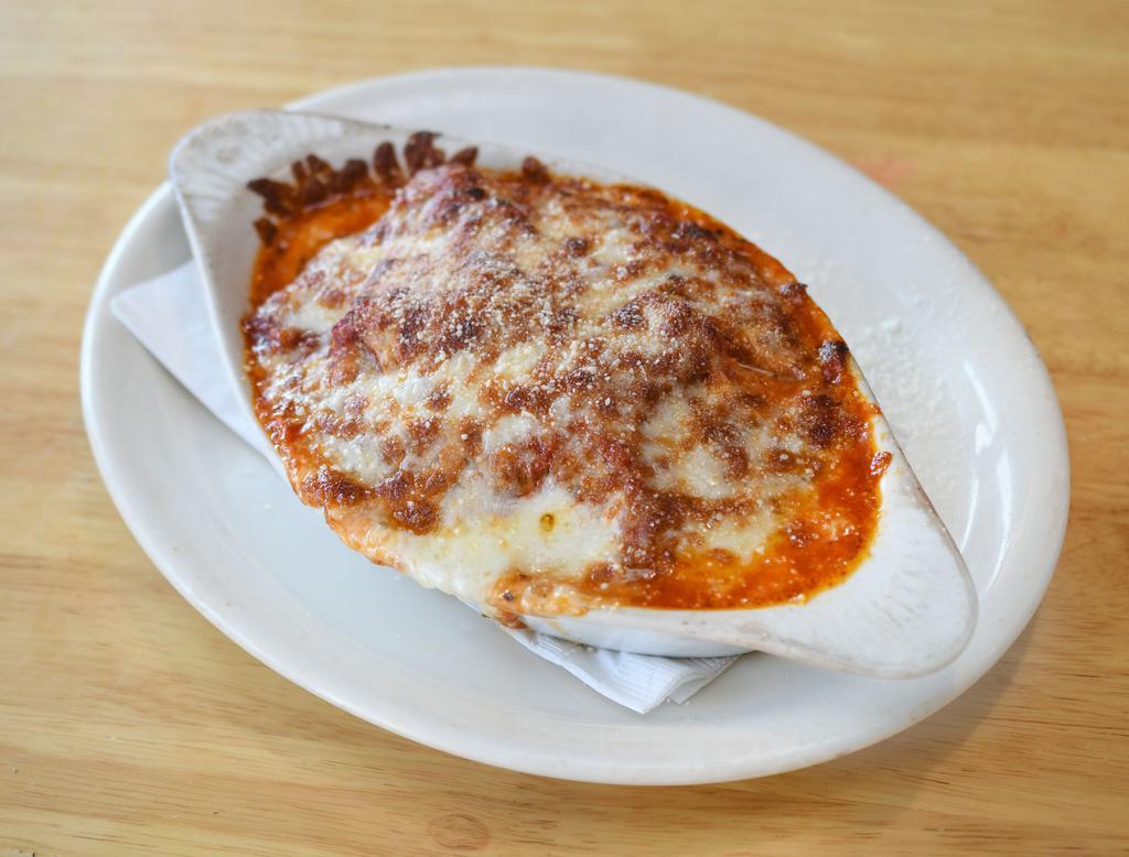 Earl's Lasagna · Freshly baked pasta with our homemade meat sauce between 6 layers of noodles. More sauce and 4 delicious cheese compliment the entire meal.