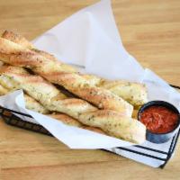Hot Bread Sticks · Our fresh handmade dough baked to a golden brown and smothered in butter, spices and Parmesa...