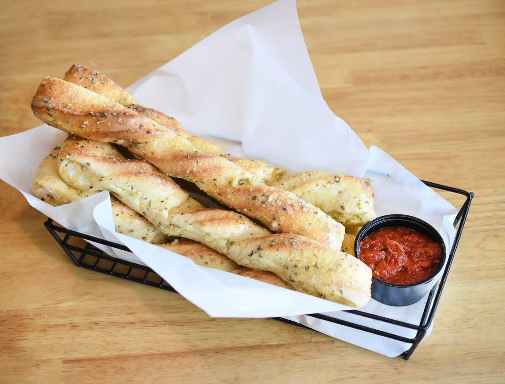 Hot Bread Sticks · Our fresh handmade dough baked to a golden brown and smothered in butter, spices and Parmesan cheese. Choose 1 sauce.
