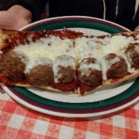 Pasquale's Italian Meatball Sandwich · Our sub roll lightly covered with butter, garlic and our special meat sauce. Then we top wit...