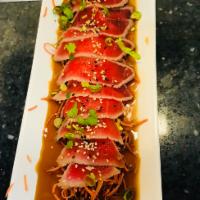 Tuna Tataki · Seared tuna, scallions, sesame seeds with ponzu sauce.
