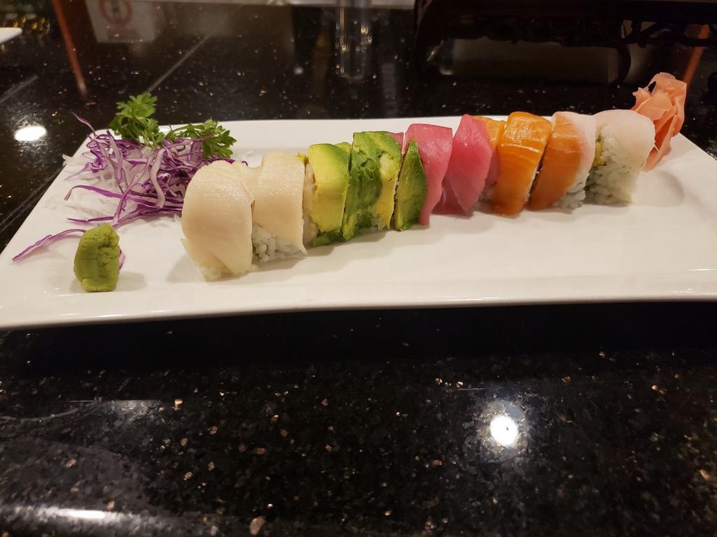 Rainbow Roll · California roll topped with avocado and assorted sashimi.