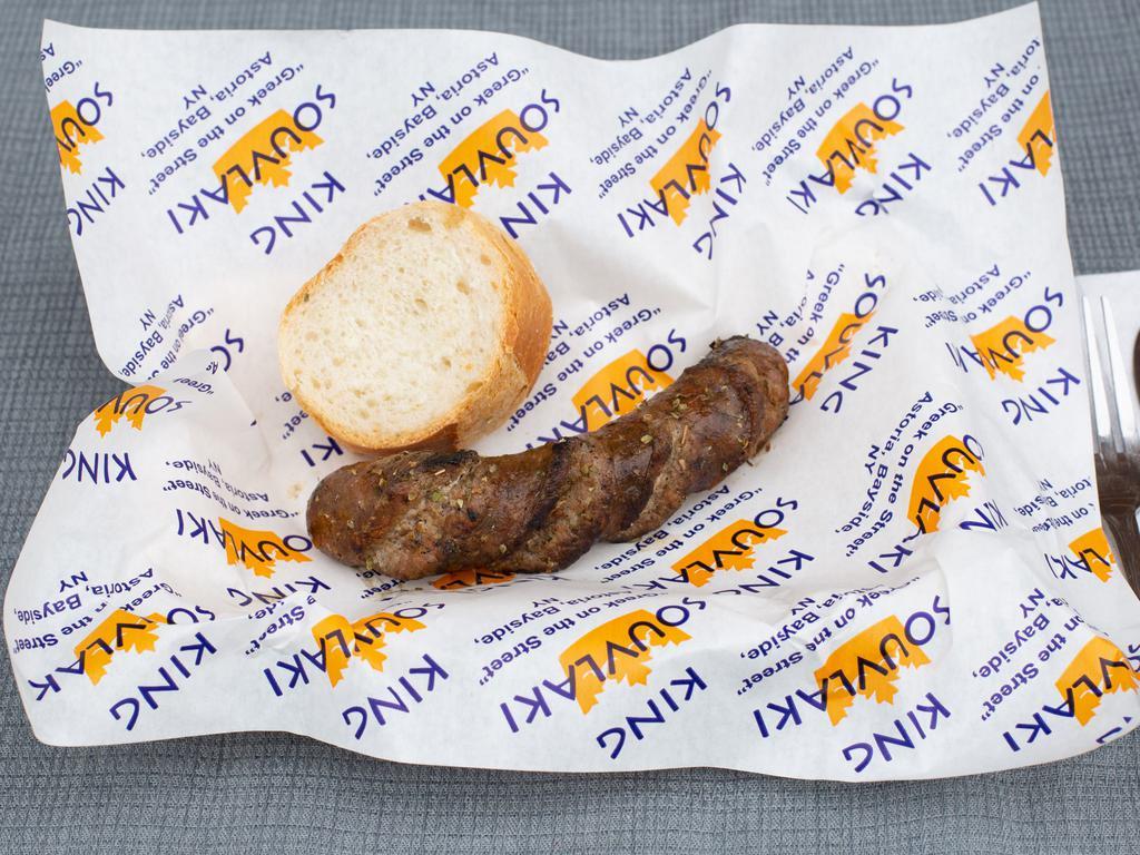 Loukaniko Horiatiko · Handmade Greek Pork Sausage grilled over a Hardwood Charcoal grill.
Served with bread.
