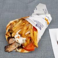 Lamb & Beef Gyro Pita Sandwich · Mouthwatering slow roasted slices of our Hand-stacked Lamb & Beef Gyro, carved off a rotisse...
