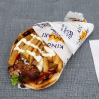 Chicken Gyro Pita Sandwich · Mouthwatering slow roasted slices of our Hand-stacked Chicken Gyro, carved off a rotisserie ...