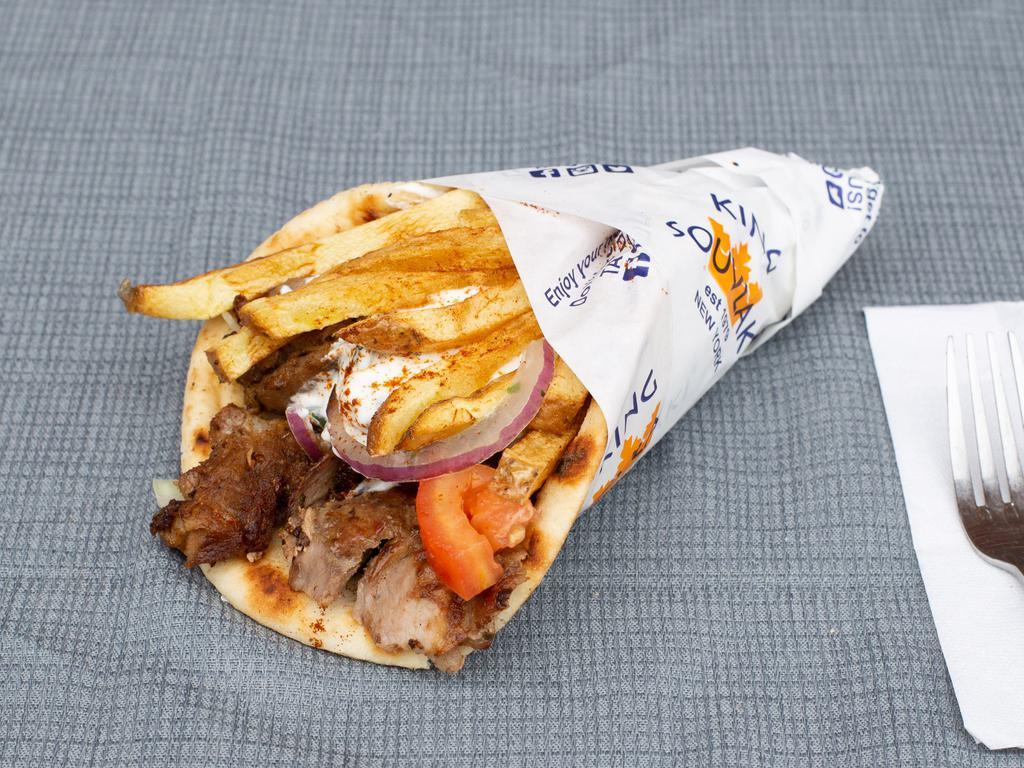 Pork Gyro Pita Sandwich · Mouthwatering slow roasted slices of our Hand-stacked Pork Gyro, carved off a rotisserie and wrapped inside a warm & toasty pita with fillings of your choice.