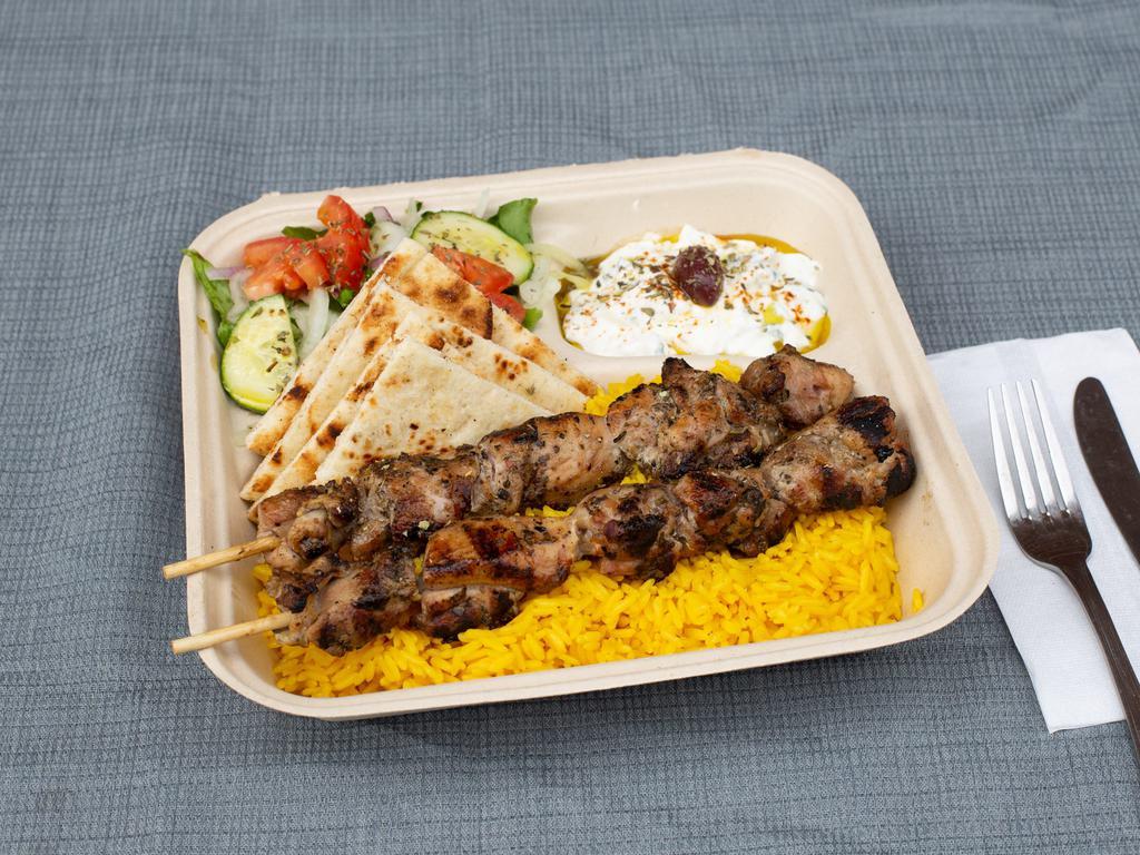 Chicken Souvlaki Platter · Two Sticks of our Hand Skewered Chicken Souvlaki over our Handcut Fries or Yellow Rice.
Comes with a side salad and your choice of bread, sauce, and toppings.