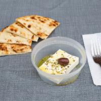 Feta Cheese · Greek Imported Feta Cheese made from Sheep and Goat Milk. Served with bread.