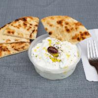 Tzatziki Dip · Homemade with Imported Greek Yogurt. Served with bread.