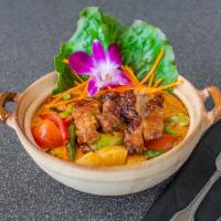 Duck Curry · Roasted duck with spicy curry paste, coconut milk, pineapple, tomatoes, bell peppers, peas, ...