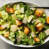 Caesar Salad · lettuce, croutons, parmesan cheese tossed in creamy caesar dressing. Served with pita bread.