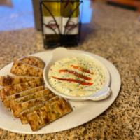 Spinach and Artichoke Dip ·  Artichokes, Spinach and Roasted Mushrooms in a Parmesan Cream Cheese Sauce. Served with Hom...