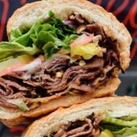 Reg Beef Deluxe · Grilled Roast Beef, Swiss Cheese, Mayo, Lettuce, Tomato, Pickles, Pepperoncinis and Onions