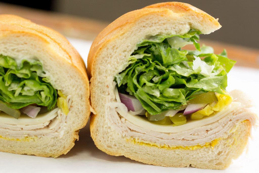 Reg Turkey · Comes with Mustard, Mayo, Lettuce, Tomatoes, Pickles, Pepperoncinis and Onions