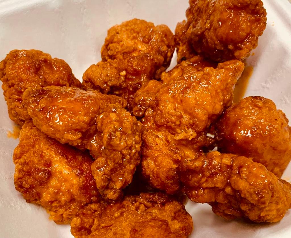 Half Pound Boneless Chicken Wings · 1/2 lb. Portion of Our Boneless Chicken Wings tossed in your choice of any one of our Signature Wing Sauces, includes your choice of one 2oz dipping sauce. 
(About 6 - 8 pc in an order)