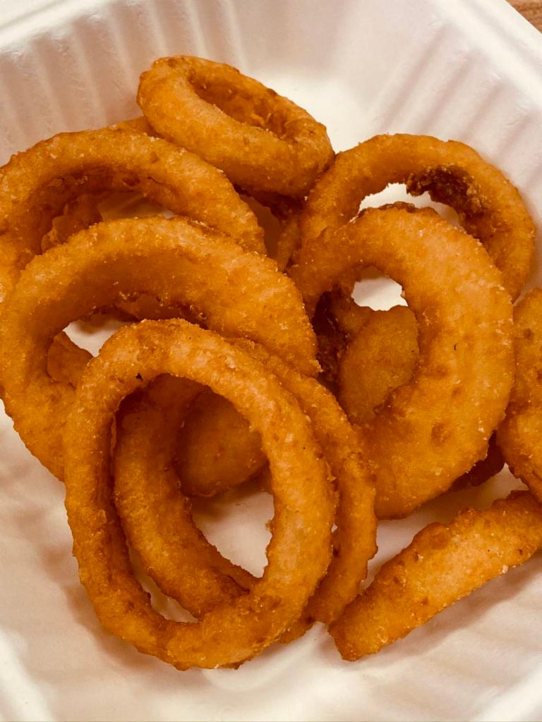 Battered Onion Rings · 1/2 lb portion of Battered Onion Rings served with your choice of two 2oz dipping sauces included.