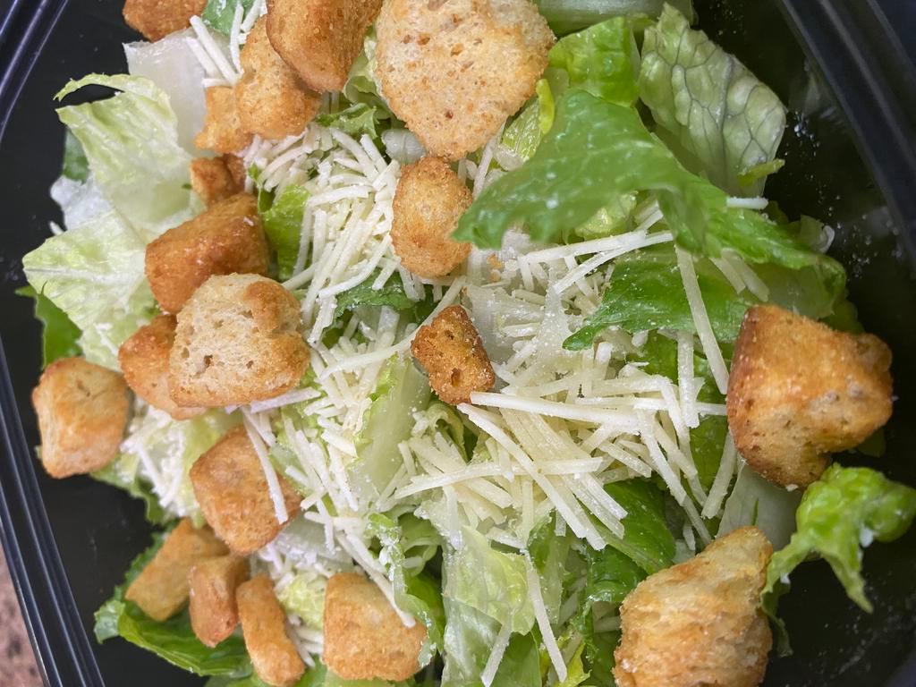 Caesar Salad - Large Size · Hand Chopped Romaine, Fancy Shredded Asiago Cheese, Croutons and two 2oz sides of dressing always served on the side.
