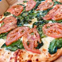 Tomato N' Spinach White Pizza · Our Thin Crust White Pizza made with Fresh Garlic, Corto® Olive Oil & Spices, Freshly Shredd...