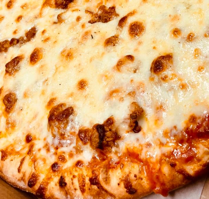 Chicken Parm Pizza · Our Marinara Sauce, Crispy Boneless Chicken Pieces, Freshly Shredded Mozzarella & Provolone Cheese and Finished w/ Extra Romano.
