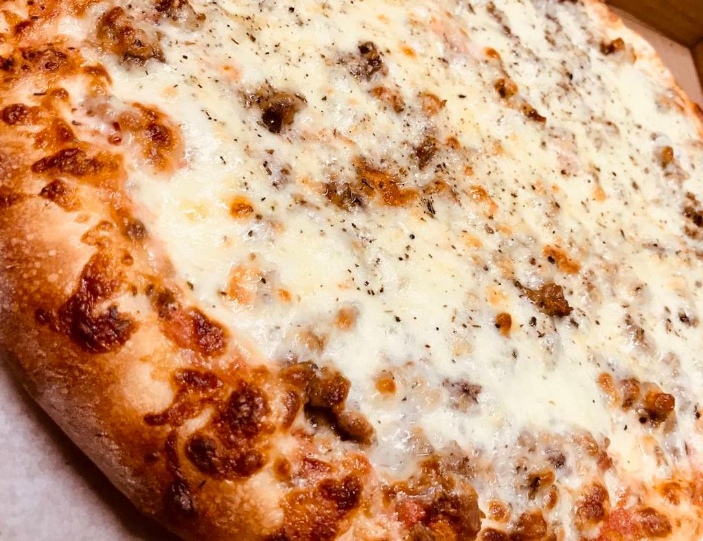 Lasagna Pizza · Our Homemade Red Pizza Sauce, Seasoned Ricotta Cheese, Seasoned Beef Crumbles, Italian Sausage Crumbles, Freshly Shredded Mozzarella, Romano Cheese & Spices.