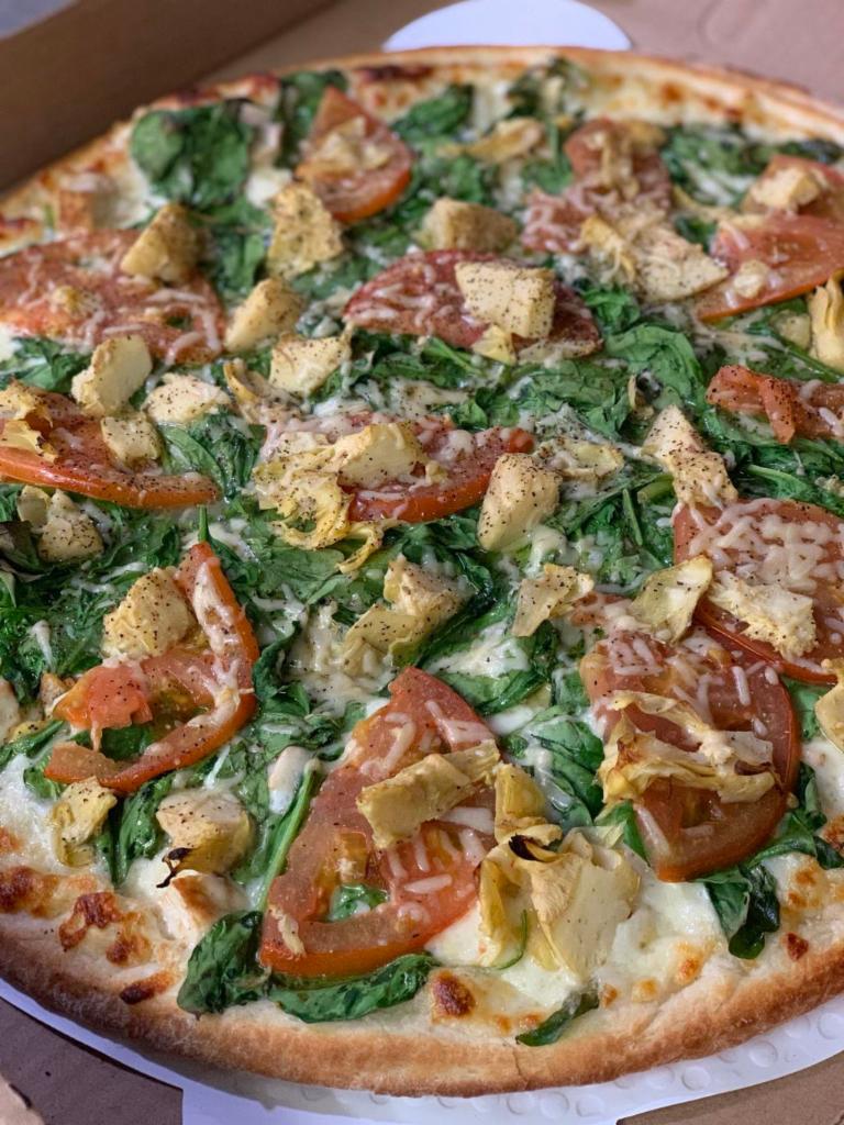 Tomato N’ Spinach Grilled Chicken White Pizza · Our Thin Crust White Pizza made with Fresh Garlic, Corto® Olive Oil & Spices, Freshly Shredded Mozzarella, Fresh Baby Spinach, Sliced Tomatoes, Grilled Chicken, Marinated Artichokes, Seasoned Ricotta then topped with Spices & Asiago Cheese!