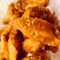 10 Piece Bone-In Chicken Wings · 10pc Bone-In Chicken Wings Tossed in One of Our Signature Wing Sauces of your Choice.
Served...