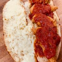 Classic Chicken Parm Sub · Three Chicken Fingers paired with your choice of cheese on an oven toasted roll over a bed o...