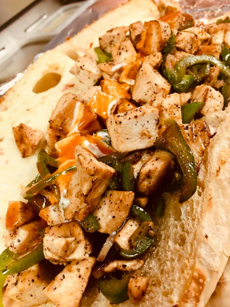 Grilled Chicken Philly Sub · Grilled Chicken Sub Done Up Philly Style - This Sub is Hooked up with your choice of cheese, grilled veggie toppings & condiments on a Large size Oven Toasted Marticello's Bread Roll.