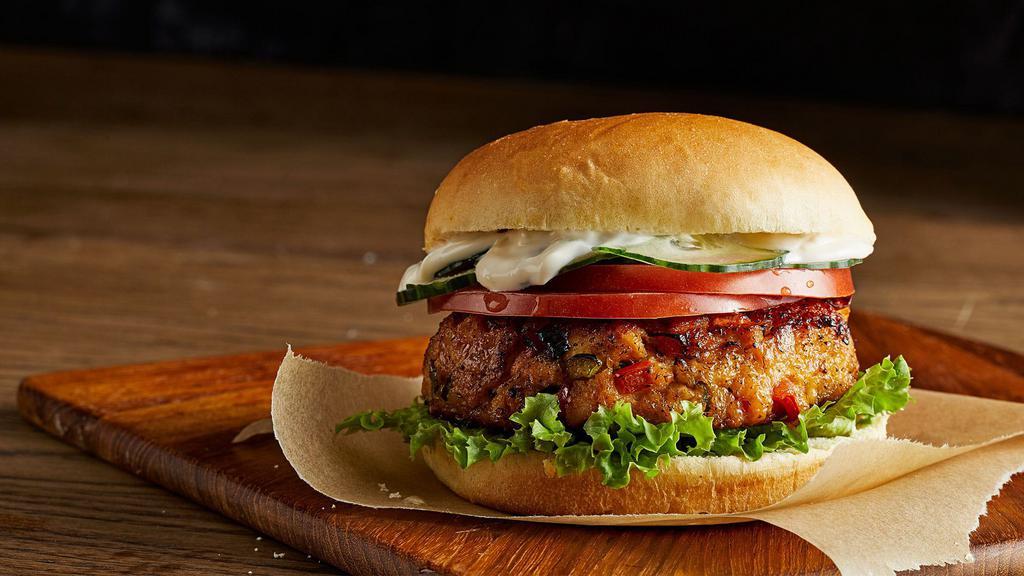 Salmon Burger & Tots Box · Sustainable Pan Seared Alaskan Wild Salmon, Blackened Seasoning, Lettuce, Tomato, Tartar Sauce. Served with Tater Tots