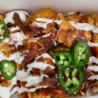 Chicken Bacon Ranch Loaded Cheese Fries or Tots · Chopped fried chicken, crisp bacon, cheddar cheese, ranch, jalapeño, sriracha