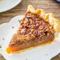 Pecan Pie · Our pecan pie has traditional filling, a light, flaky crust and a layer of Texas pecan halve...
