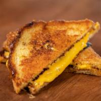 Grilled Cheese · Mom’s famous recipe made with American cheese & grilled to perfection on Thick Texas Toast