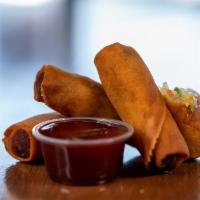 Vegetable Spring Rolls · Cabbage, celery, carrots, green onions and Chinese noodles in a crispy wonton wrapper