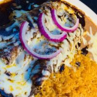 Mole Enchiladas · 2 chicken enchiladas topped with melted Jack cheese, mole sauce and onions. Served with rice...