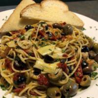 Mediterranean Spaghetti (Vegan) · Spaghetti noodles tossed with a blend of Greek olives, artichoke hearts, sun-dried tomatoes,...