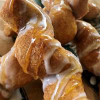 Zig Zag Donuts · Delicious fried zig zag donuts tossed in butter and cinnamon sugar and then drizzled with va...